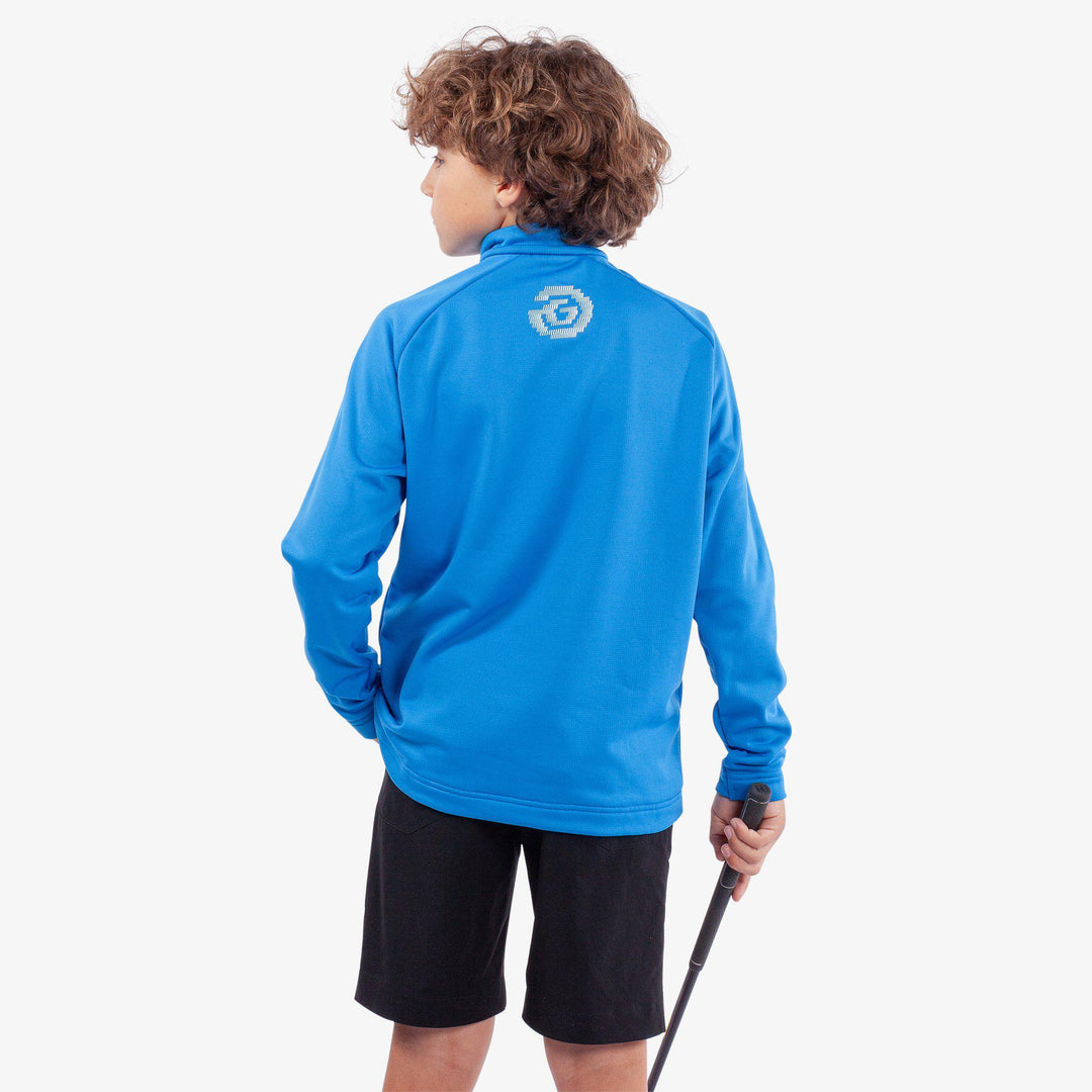 Raz is a Insulating golf mid layer for Juniors in the color Blue(4)