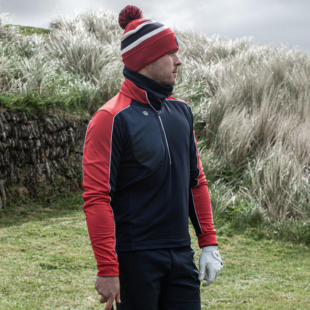 Dave is a Insulating golf mid layer for Men in the color Navy/Red(8)