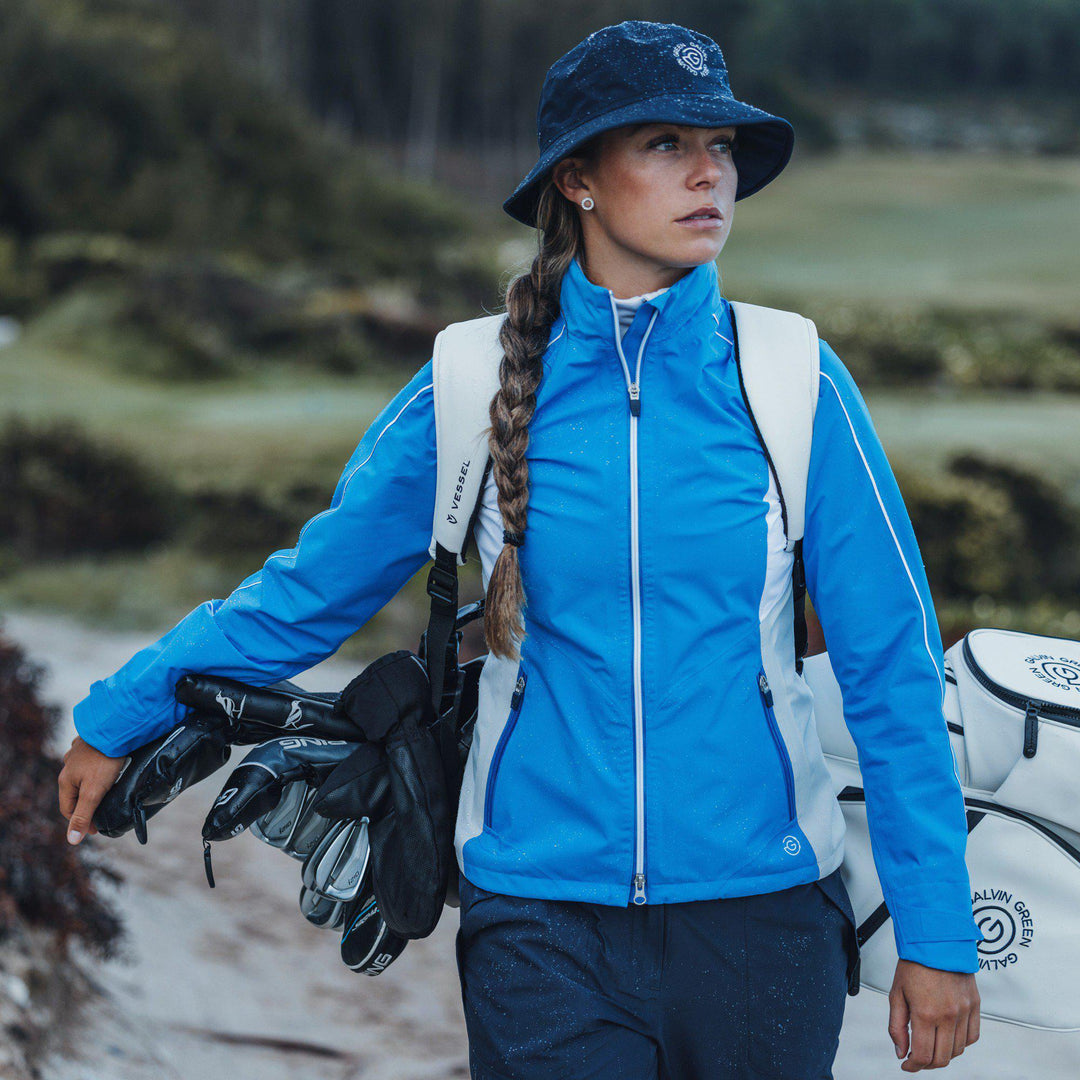 Ally is a Waterproof golf jacket for Women in the color Blue/Cool Grey/White(8)