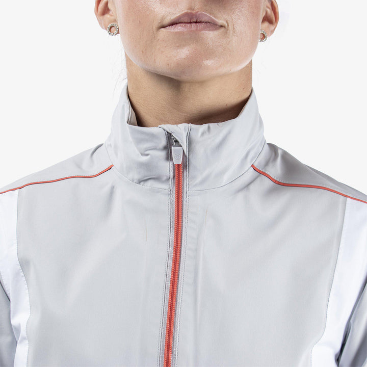 Ally is a Waterproof golf jacket for Women in the color Cool Grey/White/Coral(3)
