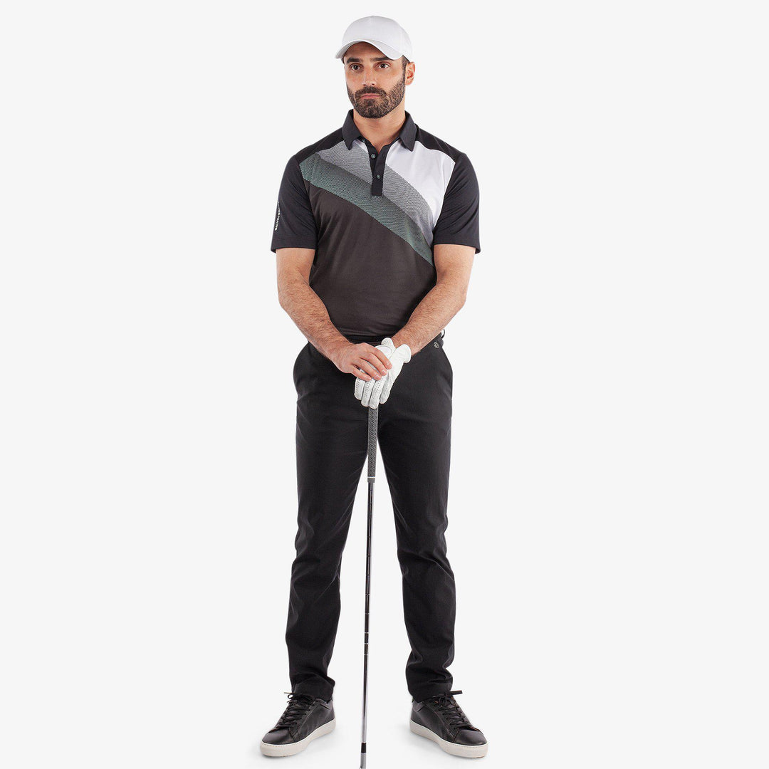 Macoy is a Breathable short sleeve golf shirt for Men in the color Black/Atlantis Green(2)