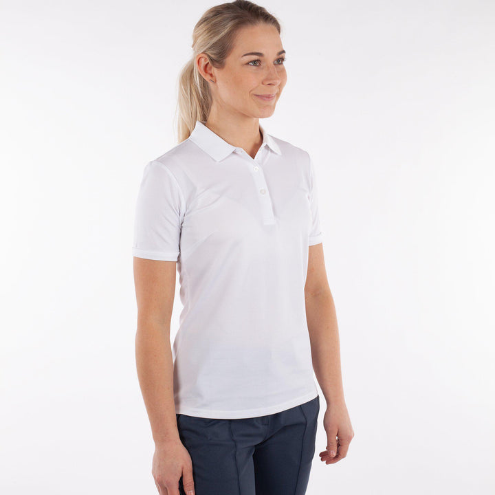 Mireya is a Breathable short sleeve golf shirt for Women in the color White(1)