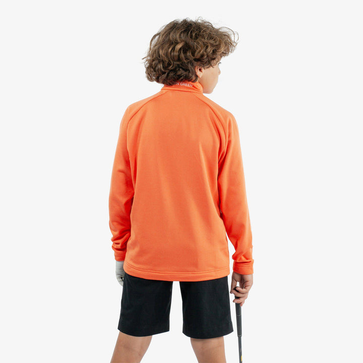 Raz is a Insulating golf mid layer for Juniors in the color Orange(4)