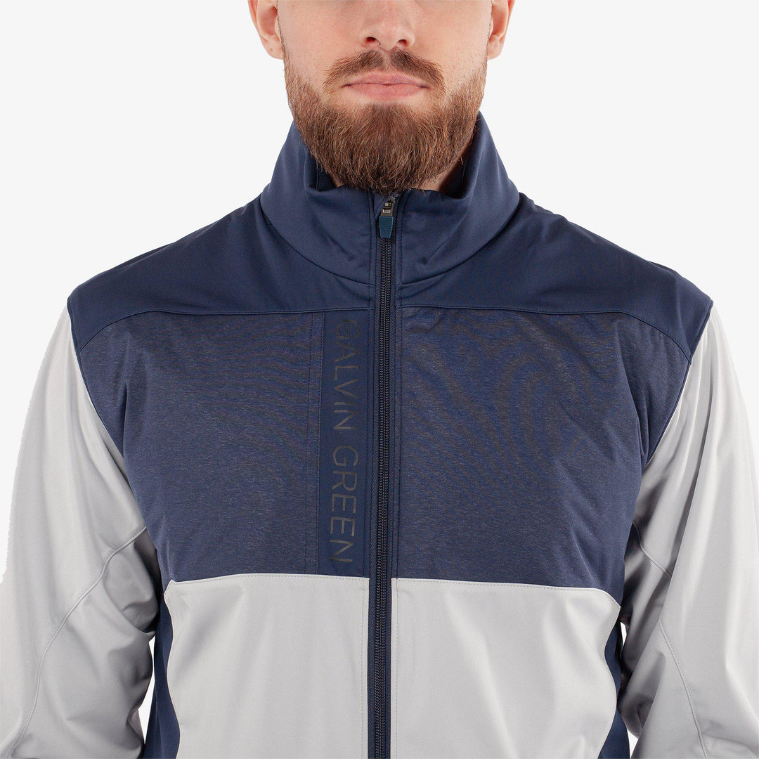 Layton is a Windproof and water repellent golf jacket for Men in the color Cool Grey/Navy(4)