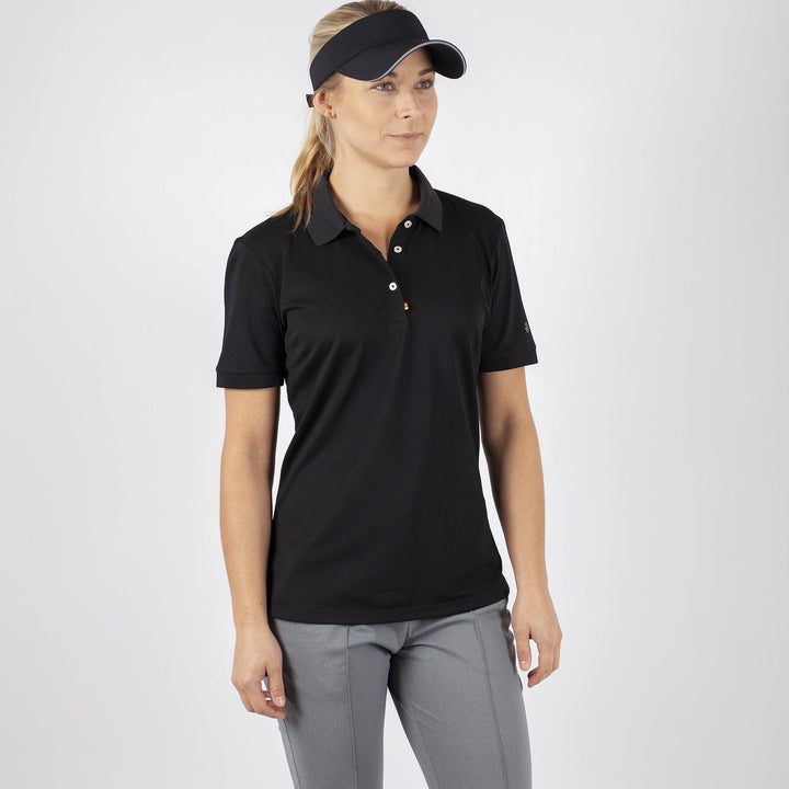 Mireya is a Breathable short sleeve golf shirt for Women in the color Black(1)