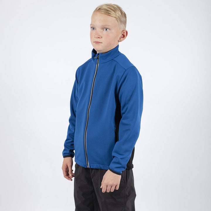 Ridley is a Windproof and water repellent golf jacket for Juniors in the color Blue Bell(1)