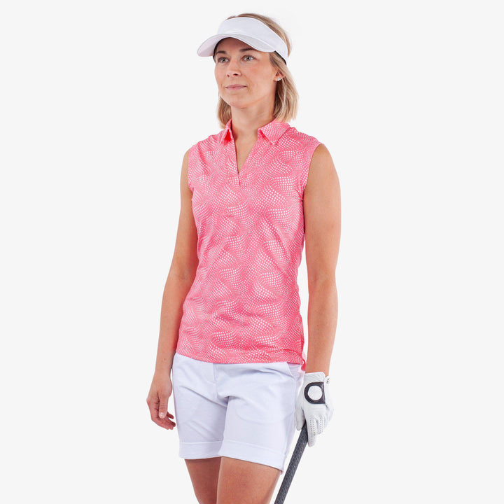 Minnie is a BREATHABLE SLEEVELESS GOLF SHIRT for Women in the color Camelia Rose/White(1)