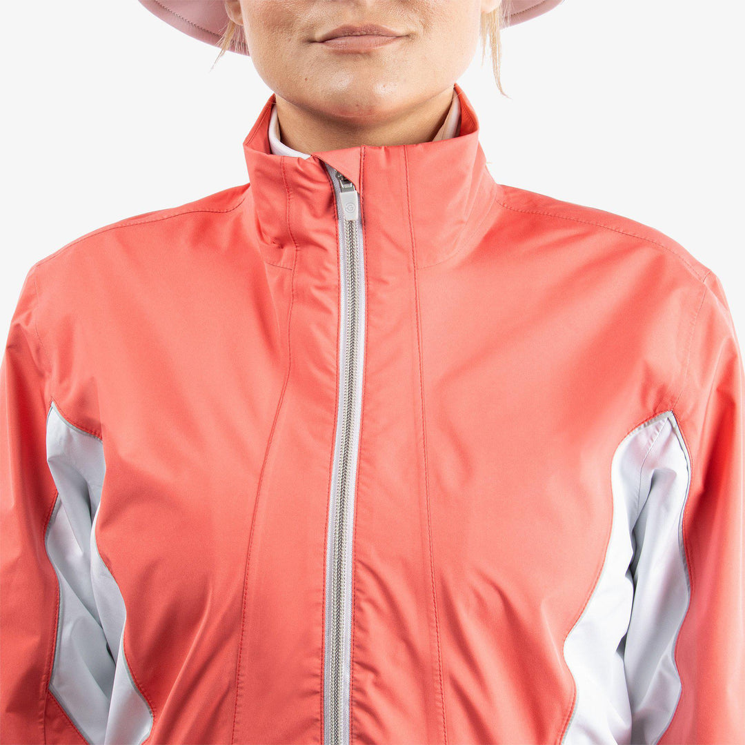 Aida is a Waterproof golf jacket for Women in the color Coral/White/Cool Grey(4)