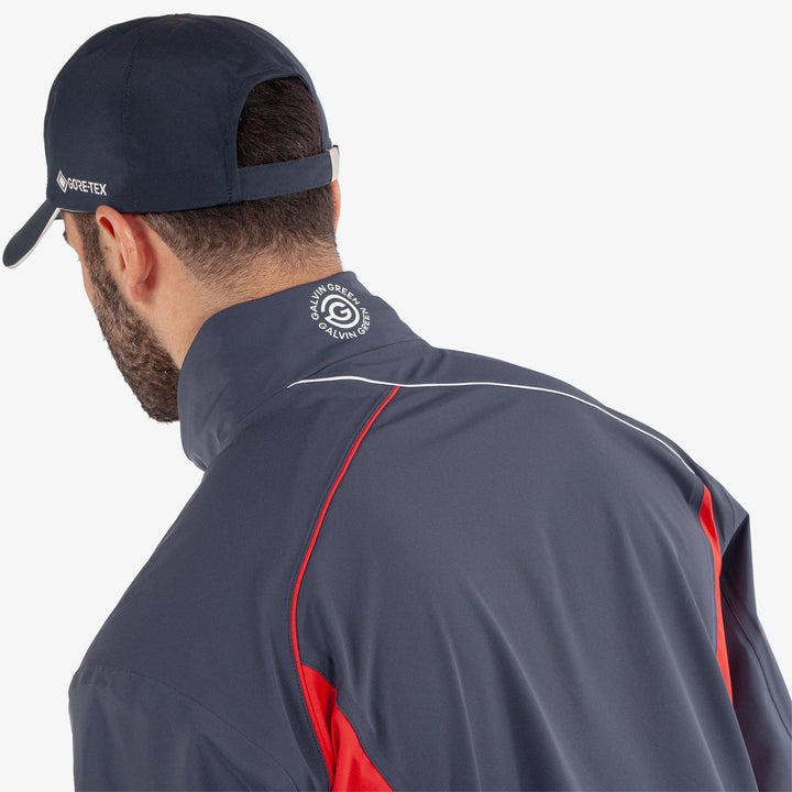 Ames is a Waterproof golf jacket for Men in the color Navy/Red(7)