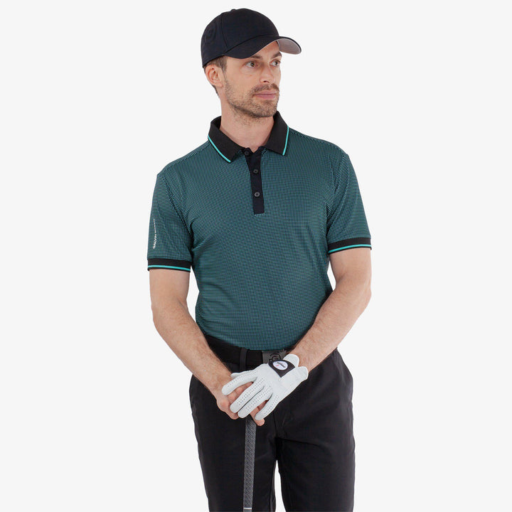 Miller is a Breathable short sleeve golf shirt for Men in the color Black/Atlantis Green(1)