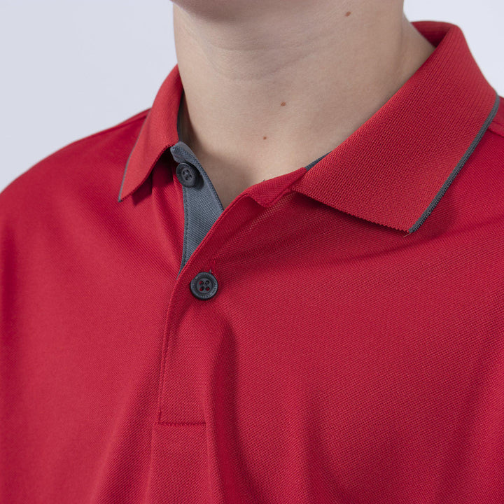 Rod is a Breathable short sleeve golf shirt for Juniors in the color Red(2)