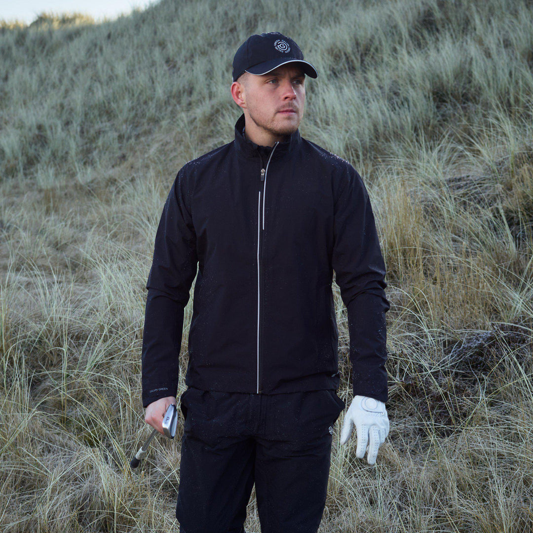 Arvin is a Waterproof golf jacket for Men in the color Black/Sharkskin(8)