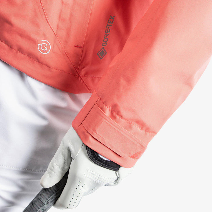 Aida is a Waterproof golf jacket for Women in the color Coral/White/Cool Grey(6)