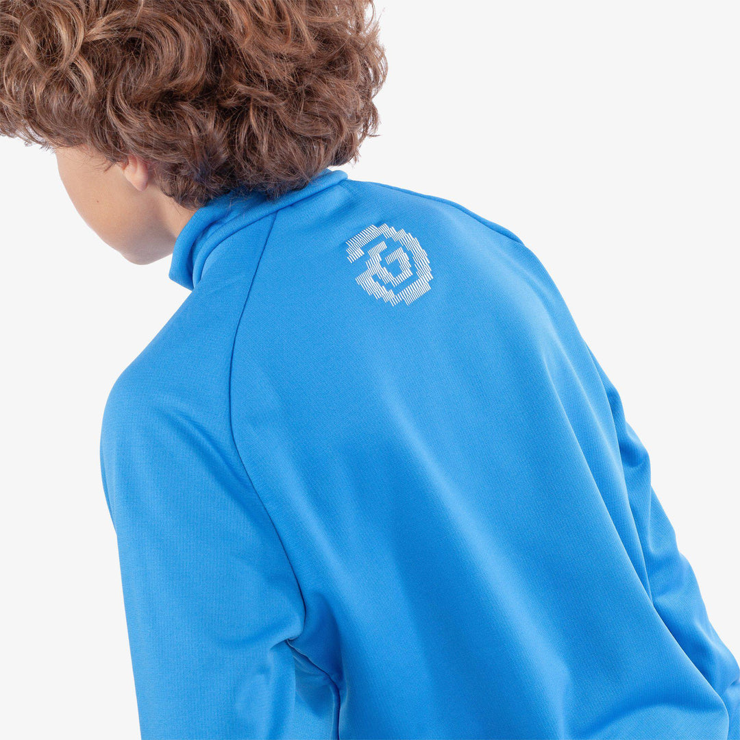 Raz is a Insulating golf mid layer for Juniors in the color Blue(5)