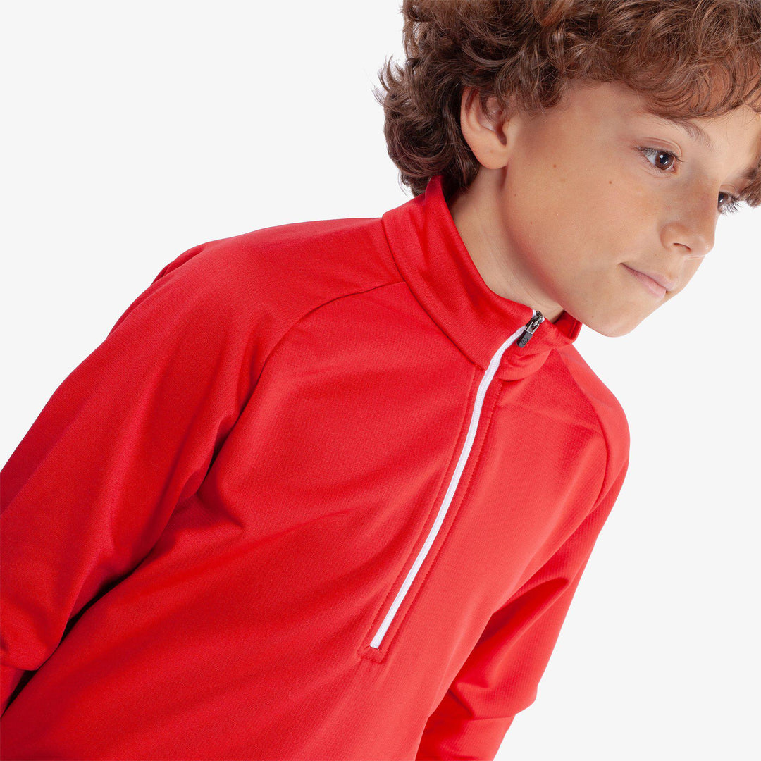 Raz is a Insulating golf mid layer for Juniors in the color Red(3)