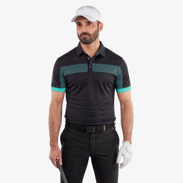 Mills is a Breathable short sleeve golf shirt for Men in the color Black/Atlantis Green(1)
