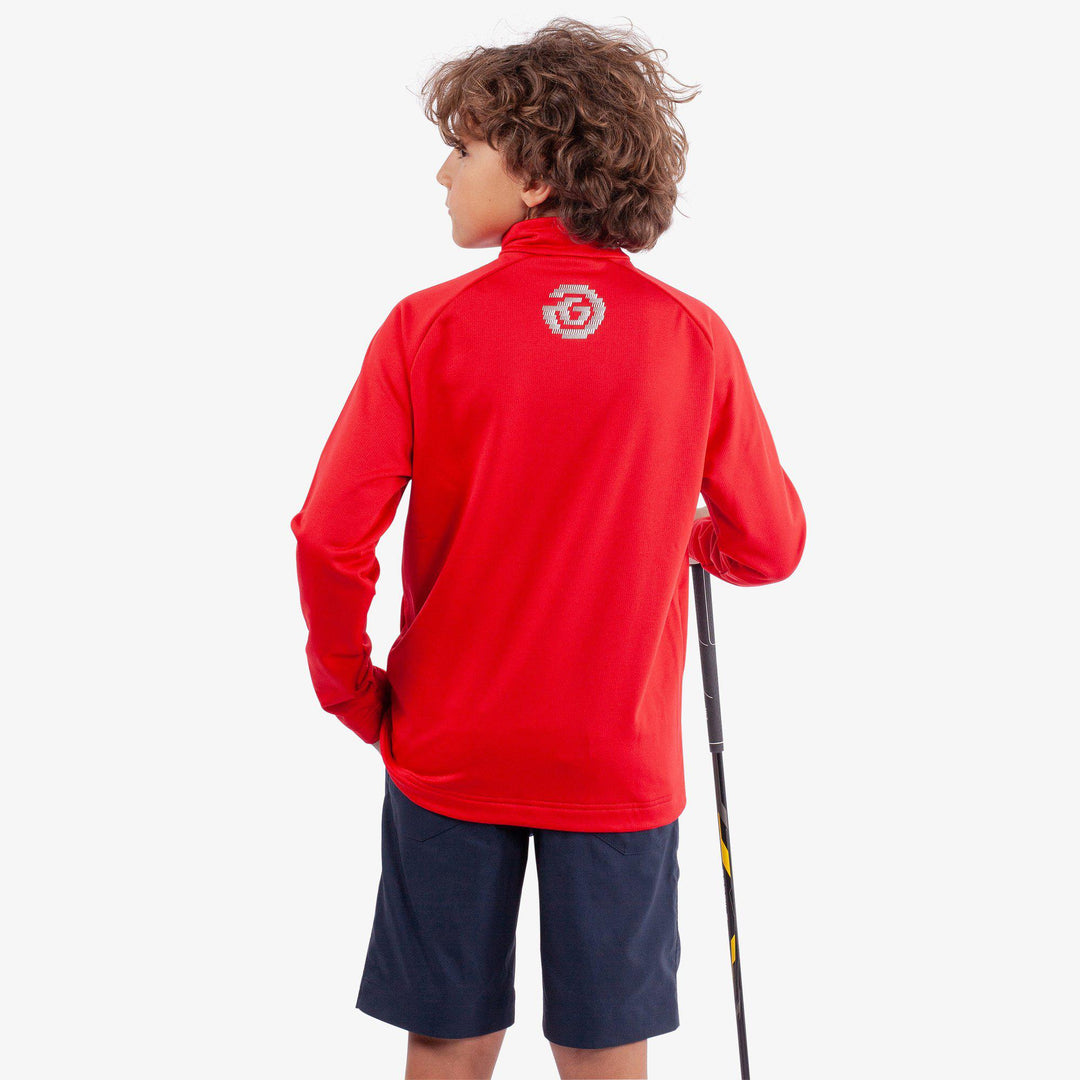 Raz is a Insulating golf mid layer for Juniors in the color Red(4)