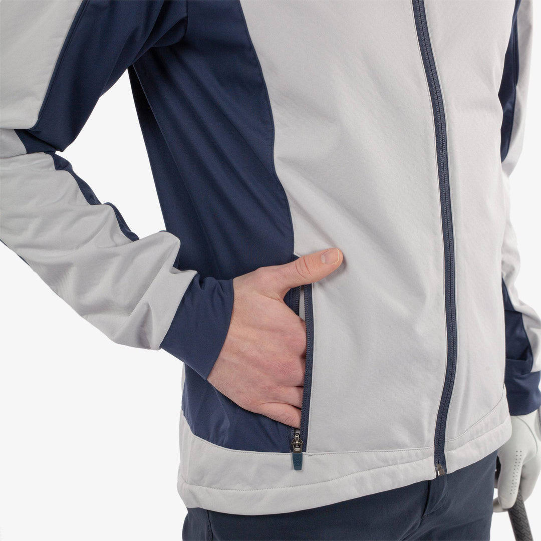 Lyndon is a Windproof and water repellent golf jacket for Men in the color Cool Grey/Navy(3)