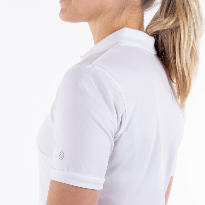 Mireya is a Breathable short sleeve golf shirt for Women in the color White(3)