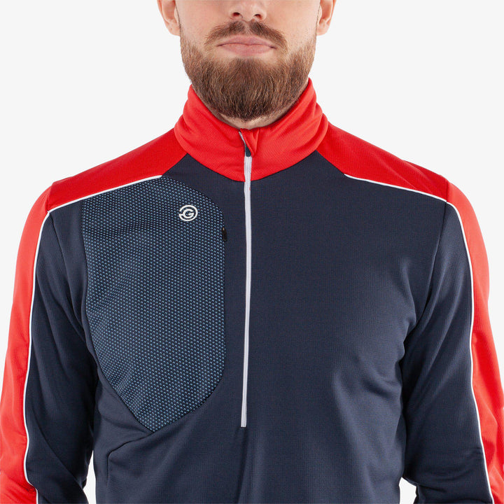 Dave is a Insulating golf mid layer for Men in the color Navy/Red(3)