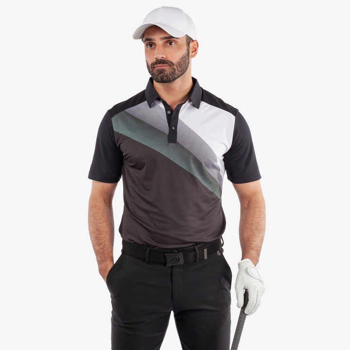 Macoy is a Breathable short sleeve golf shirt for Men in the color Black/Atlantis Green(1)