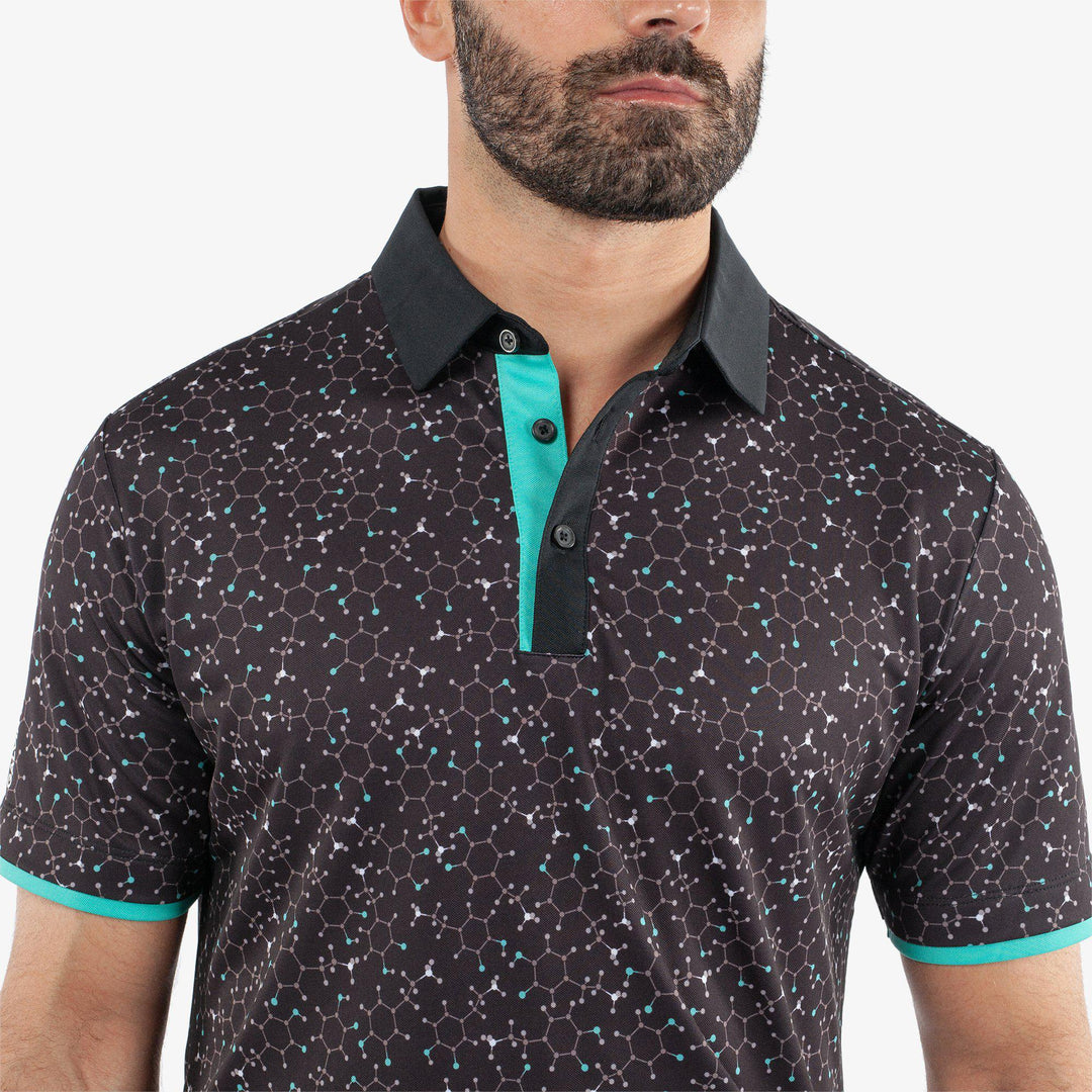 Mannix is a Breathable short sleeve golf shirt for Men in the color Black/Atlantis Green(3)
