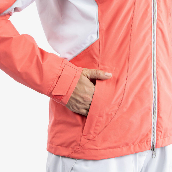 Aida is a Waterproof golf jacket for Women in the color Coral/White/Cool Grey(5)