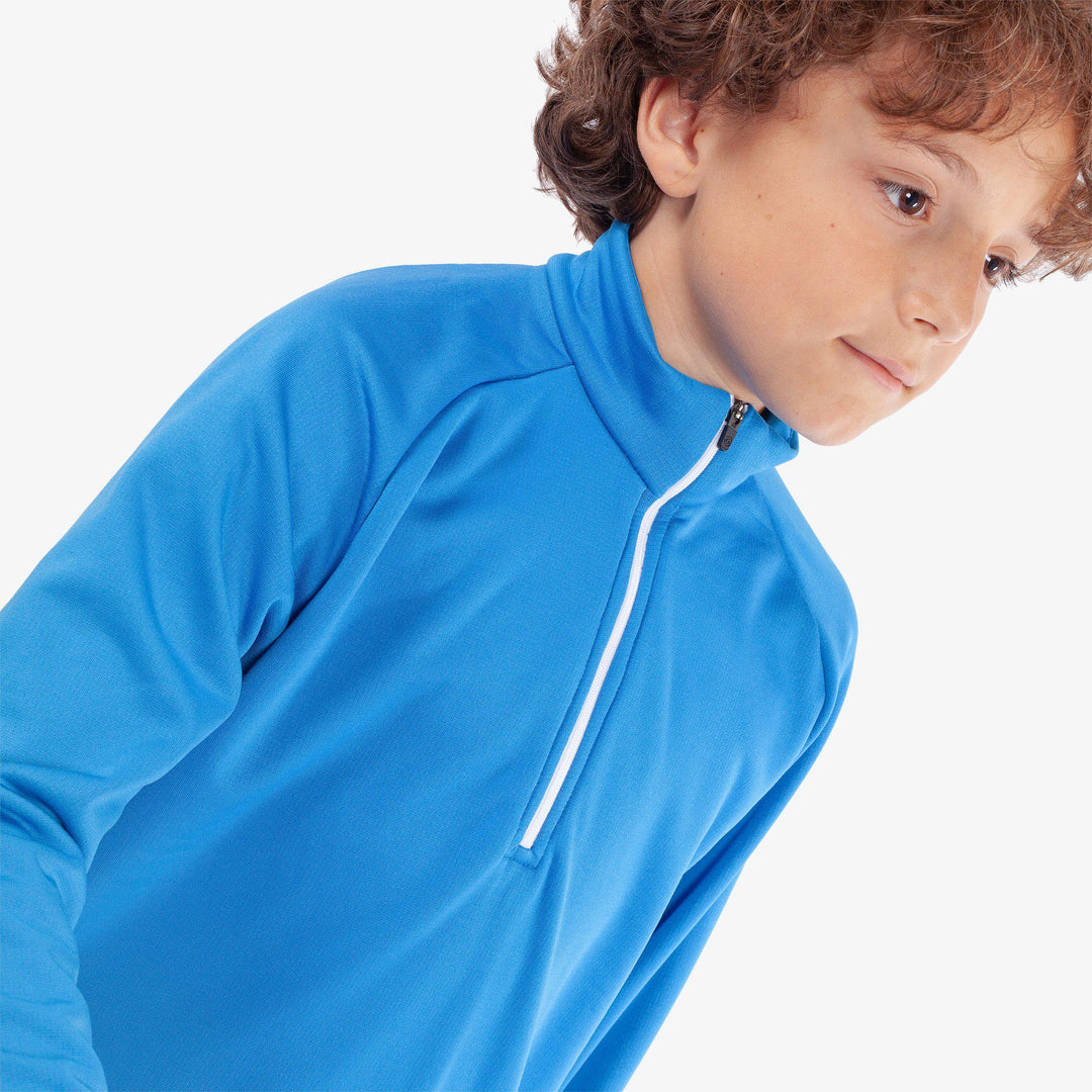 Raz is a Insulating golf mid layer for Juniors in the color Blue(3)