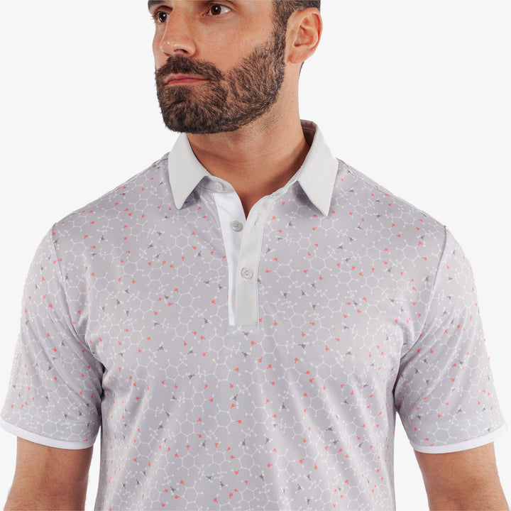 Mannix is a Breathable short sleeve golf shirt for Men in the color Cool Grey/Coral(3)