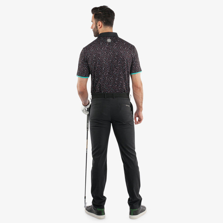 Mannix is a Breathable short sleeve golf shirt for Men in the color Black/Atlantis Green(6)
