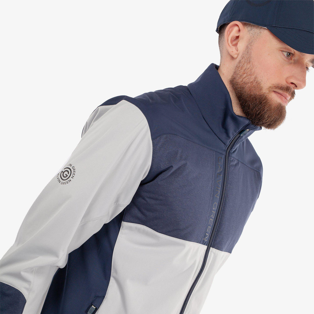 Layton is a Windproof and water repellent golf jacket for Men in the color Cool Grey/Navy(3)