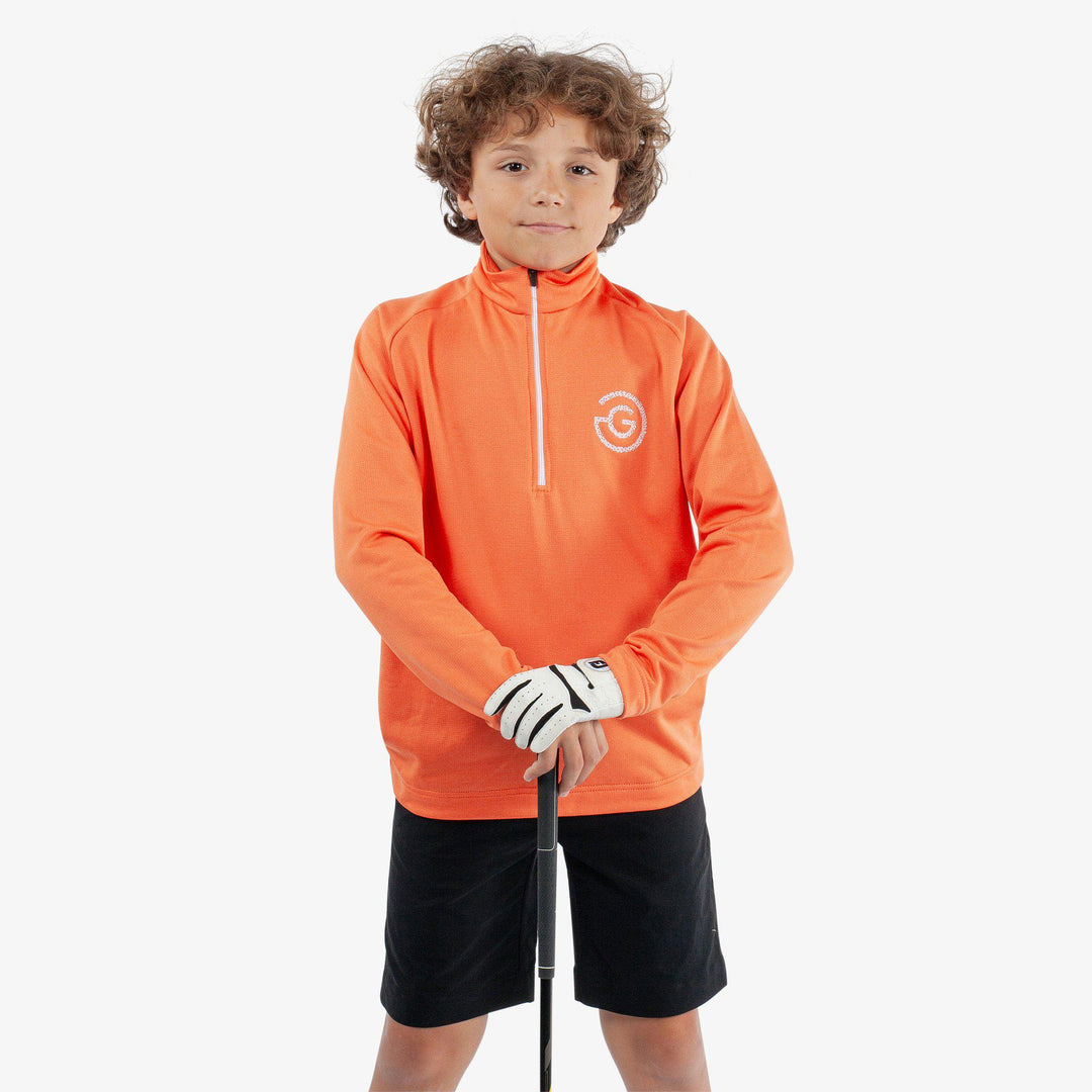 Raz is a Insulating golf mid layer for Juniors in the color Orange(1)