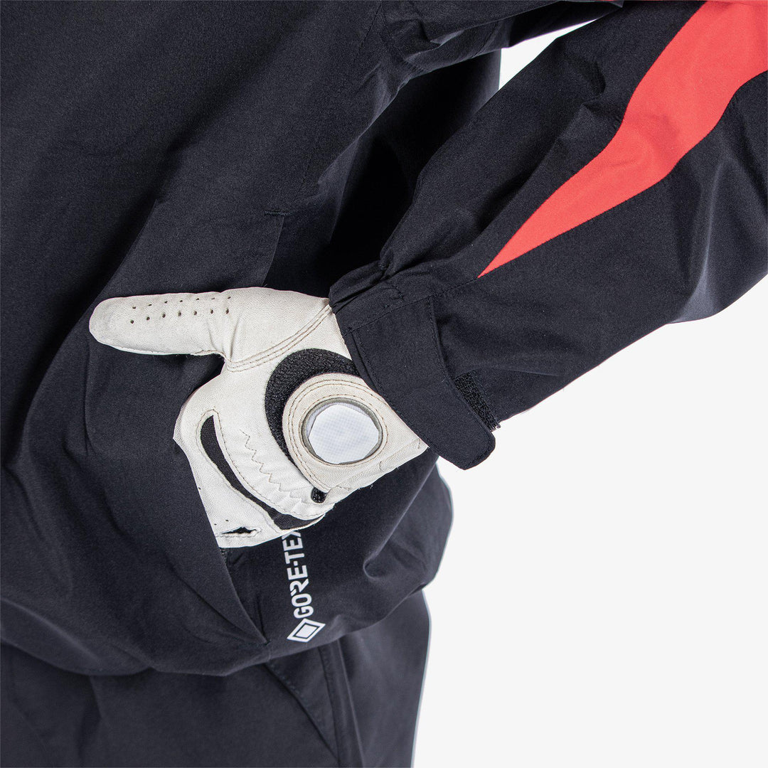 Robert is a Waterproof golf jacket for Juniors in the color Black/Red(5)