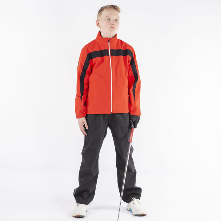 Robert is a Waterproof golf jacket for Juniors in the color Red(1)