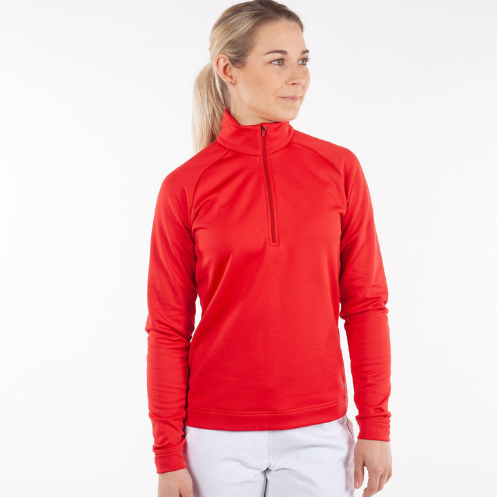 Dolly is a Insulating mid golf layer for Women in the color Red(1)