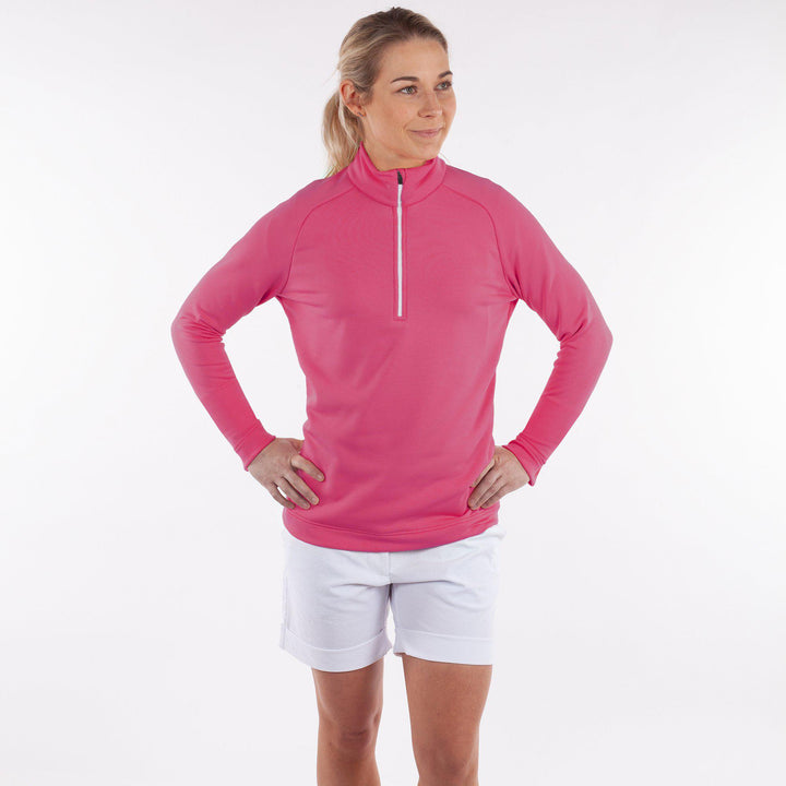 Dolly Upcycled is a Insulating golf mid layer for Women in the color Sugar Coral(3)