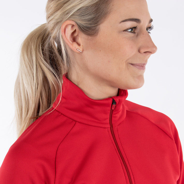 Dolly is a Insulating mid golf layer for Women in the color Red(2)