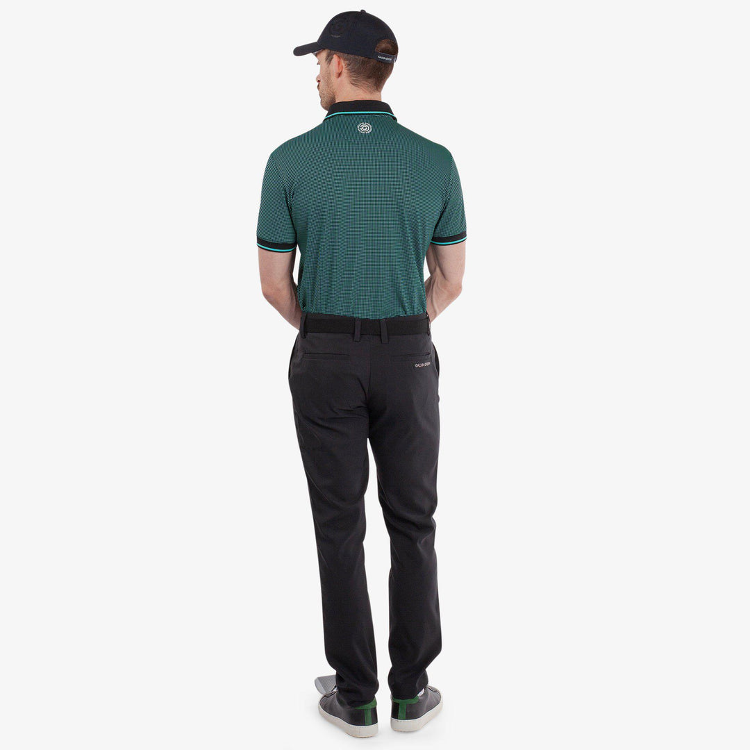Miller is a Breathable short sleeve golf shirt for Men in the color Black/Atlantis Green(6)