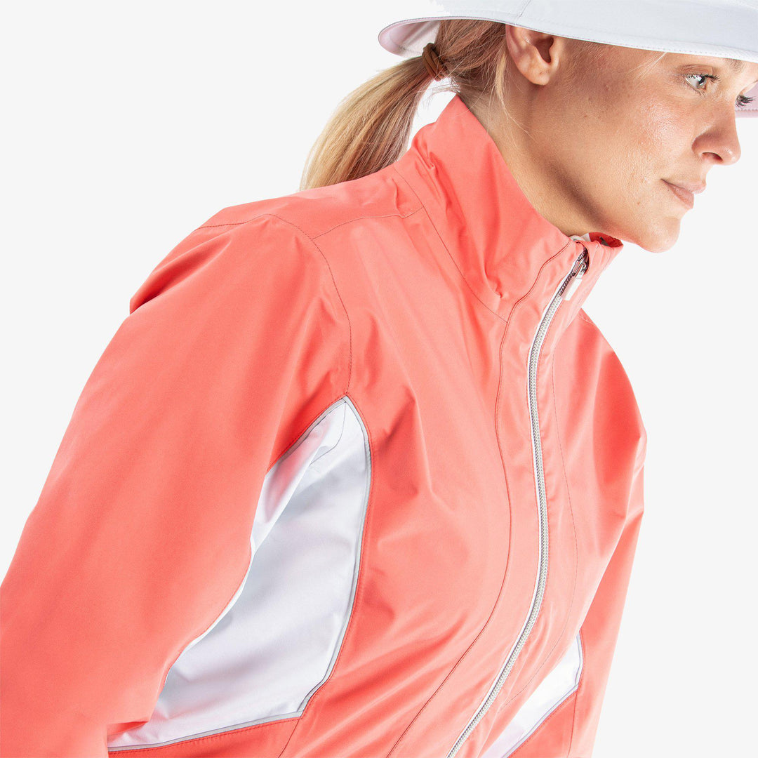 Aida is a Waterproof golf jacket for Women in the color Coral/White/Cool Grey(3)