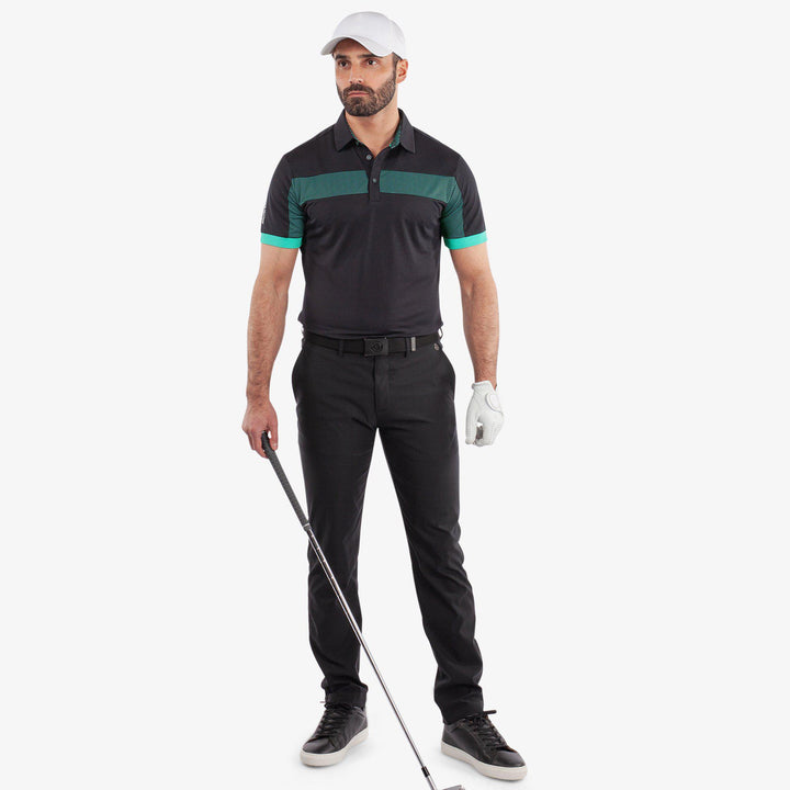 Mills is a Breathable short sleeve golf shirt for Men in the color Black/Atlantis Green(2)