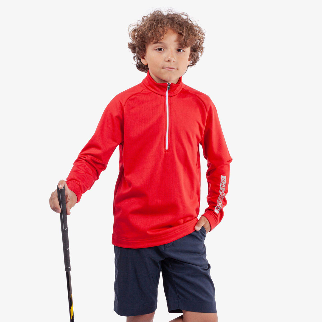 Raz is a Insulating golf mid layer for Juniors in the color Red(1)