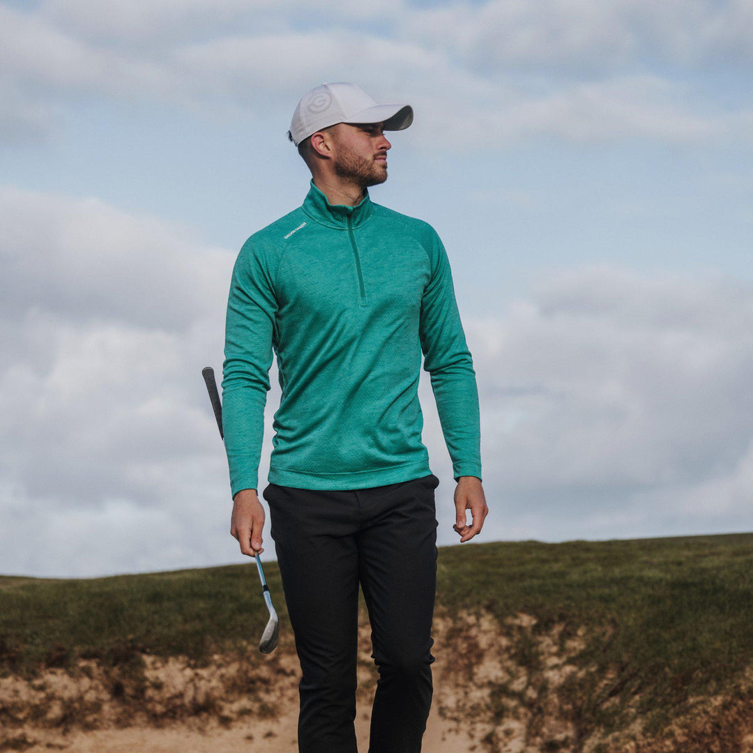 Dion is a Insulating golf mid layer for Men in the color Atlantis Green Melange(8)