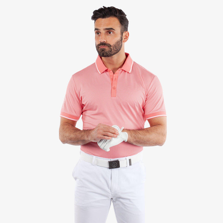 Miller is a Breathable short sleeve golf shirt for Men in the color Coral/White (1)