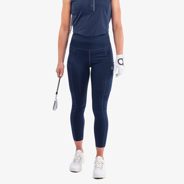 Nicoline is a Breathable and stretchy golf leggings for Women in the color Navy(1)