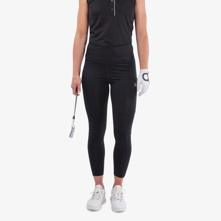 Nicoline is a Breathable and stretchy golf leggings for Women in the color Black(1)