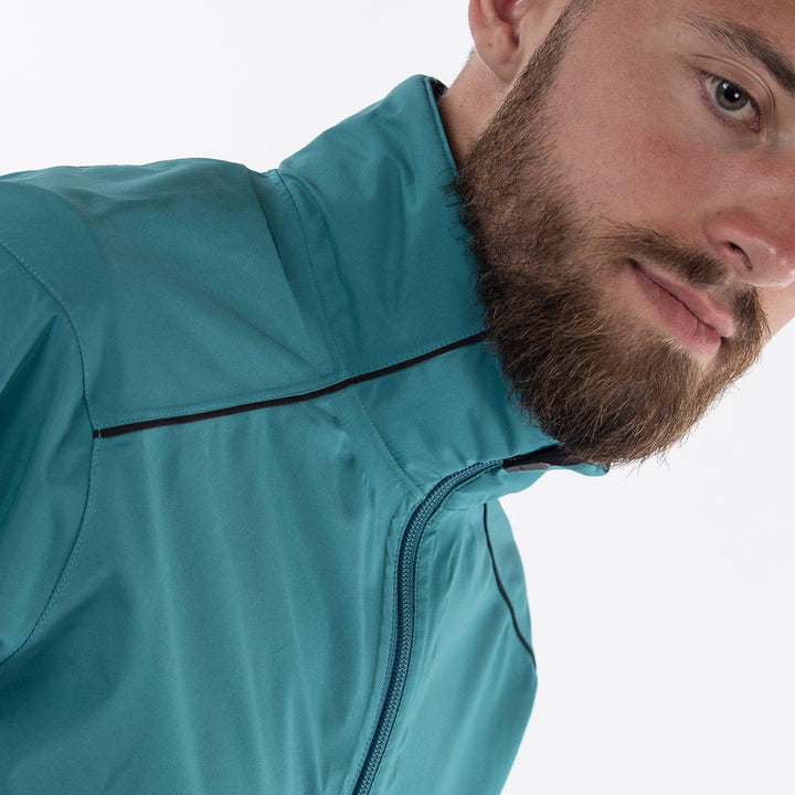 Alec is a Waterproof golf jacket for Men in the color Sugar Coral(2)