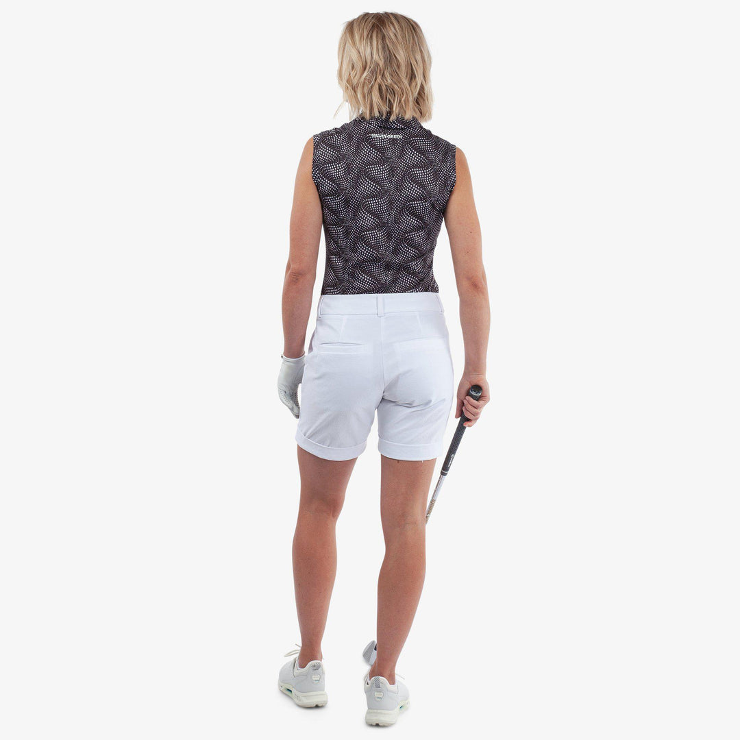 Minnie is a BREATHABLE SLEEVELESS GOLF SHIRT for Women in the color Black/White(6)