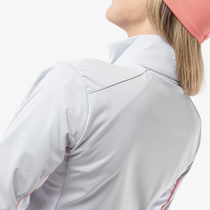 Larissa is a Windproof and water repellent golf jacket for Women in the color Cool Grey/White/Coral(7)