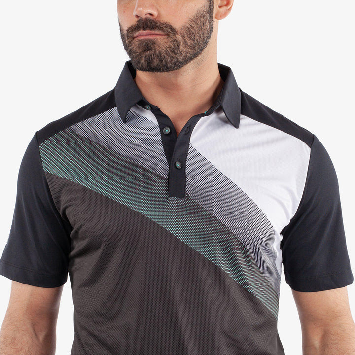 Macoy is a Breathable short sleeve golf shirt for Men in the color Black/Atlantis Green(8)
