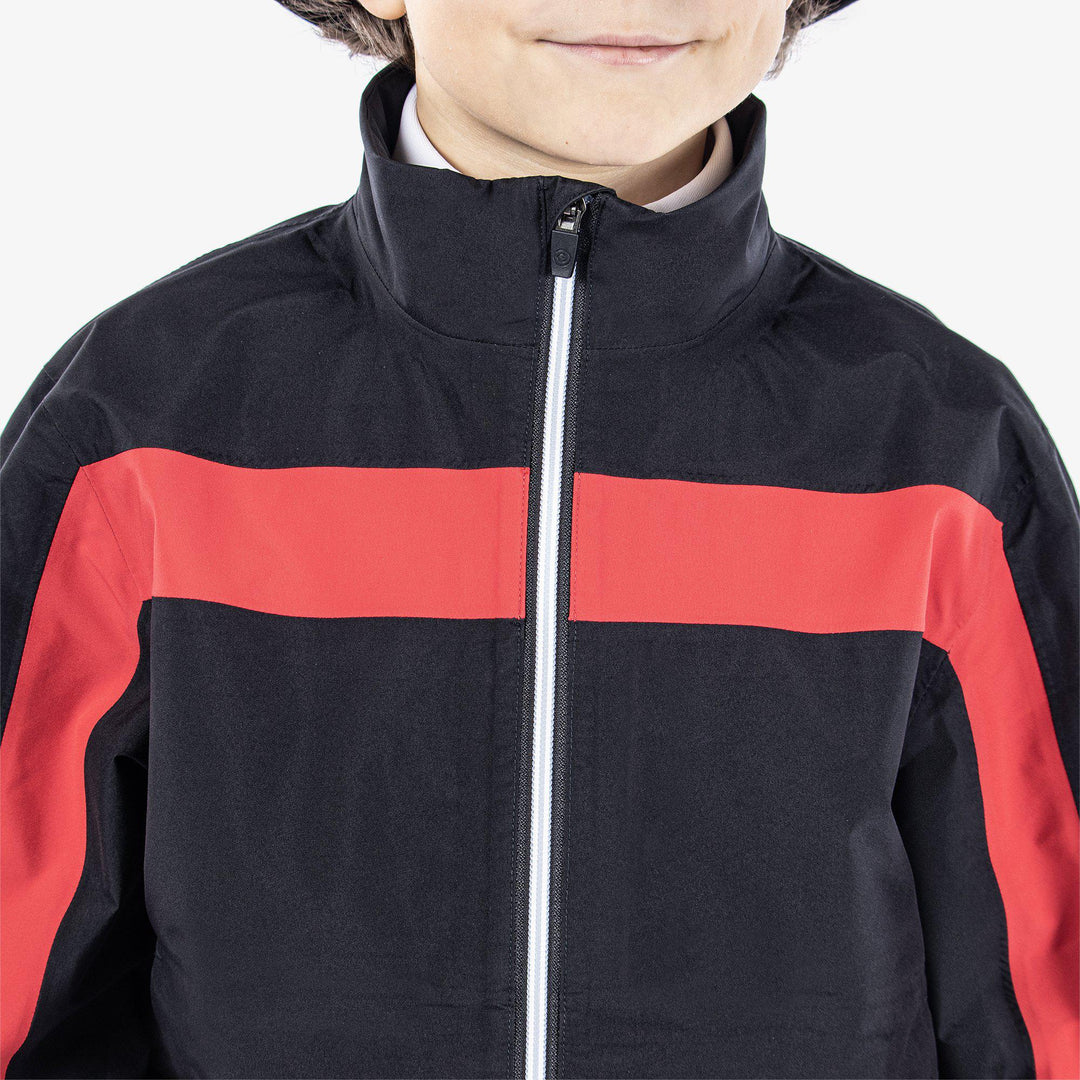 Robert is a Waterproof golf jacket for Juniors in the color Black/Red(3)